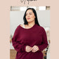 Plus-size model in Doesn’t Compare V-Neck maroon off-shoulder top