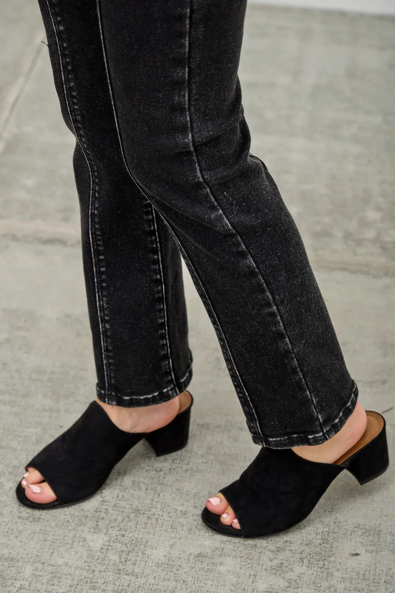 Black suede mule heels with low block heel, open toe, styled with Saige Denim jeans