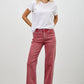 High-waisted red Saige denim jeans with straight-leg cut and subtle fading