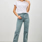 High-waisted light blue faded flare jeans with rolled cuffs