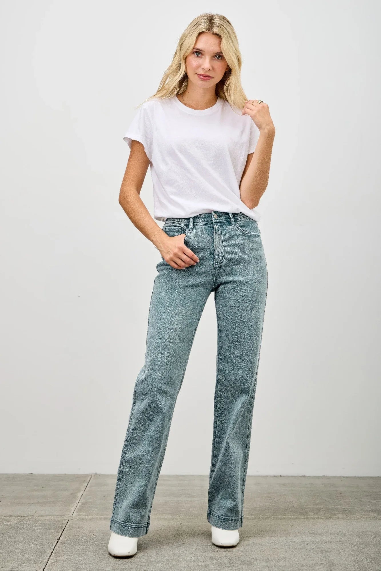 High-waisted light blue faded flare jeans with rolled cuffs