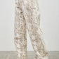 Seige Denim plus size high rise wide-leg jeans with abstract paint-splatter pattern