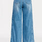 Saige Denim high-rise wide-leg tummy control jeans in medium-wash blue