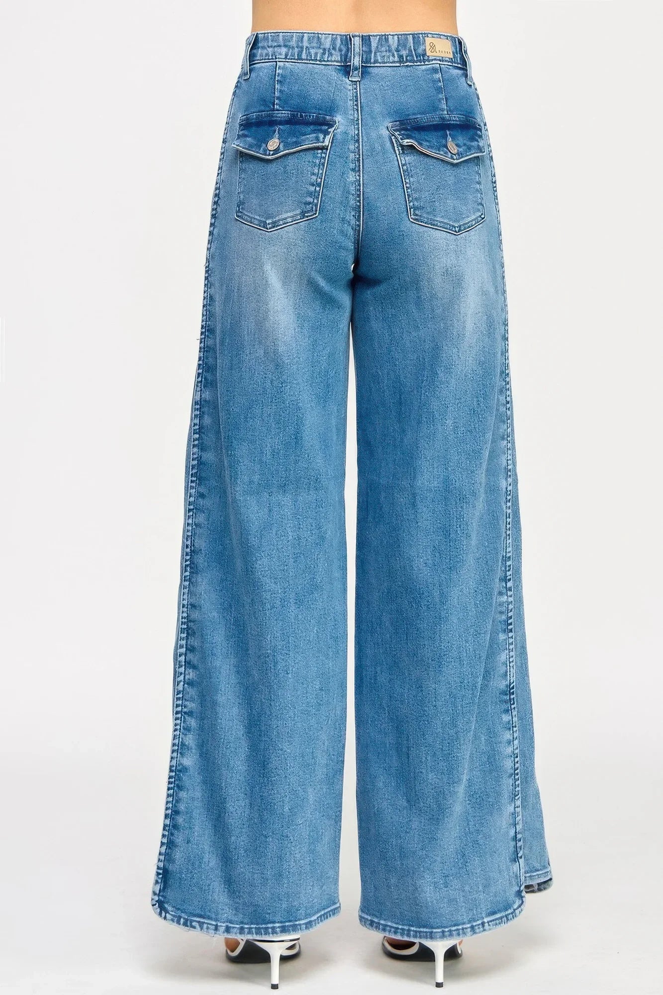 Saige Denim high-rise wide-leg tummy control jeans in medium-wash blue