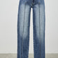 High-waisted wide-leg denim jeans in medium blue wash with frayed hems