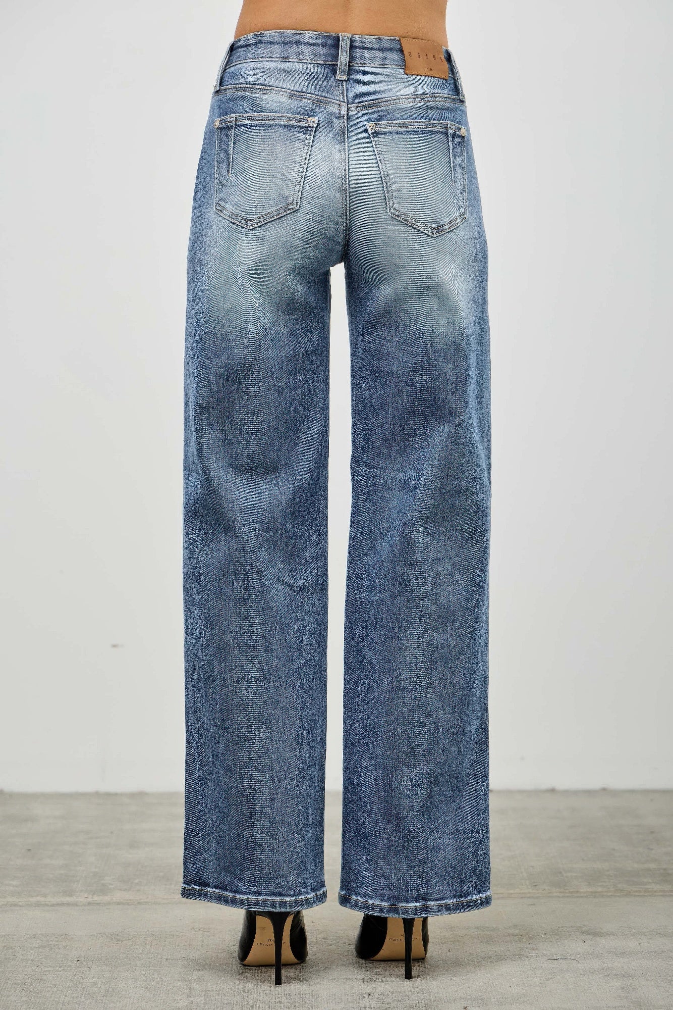 Mid-rise straight pintuck wide-leg denim jeans in medium-wash blue with fading and distressing