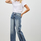 High-waisted wide-leg denim jeans in medium blue wash with fading and stitching