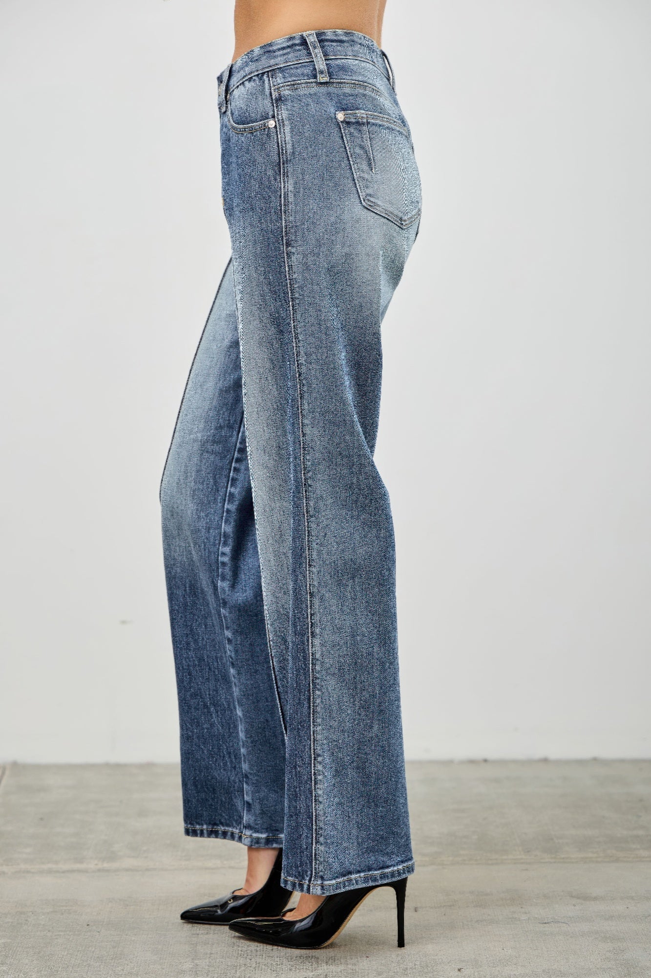 Mid-rise straight pintuck high-waisted wide-leg denim jeans in medium blue wash with fading and frayed hems