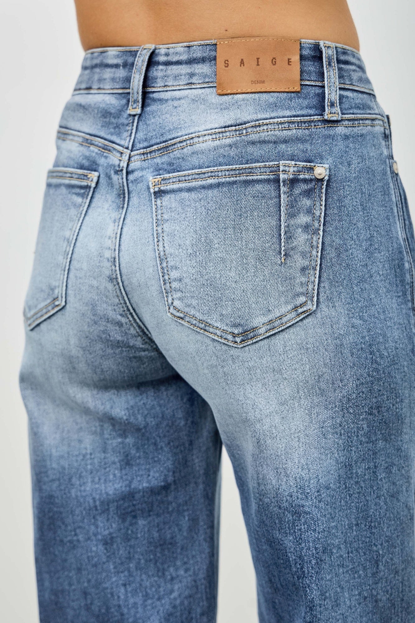 Mid-rise straight light-wash denim jeans with Saige leather patch