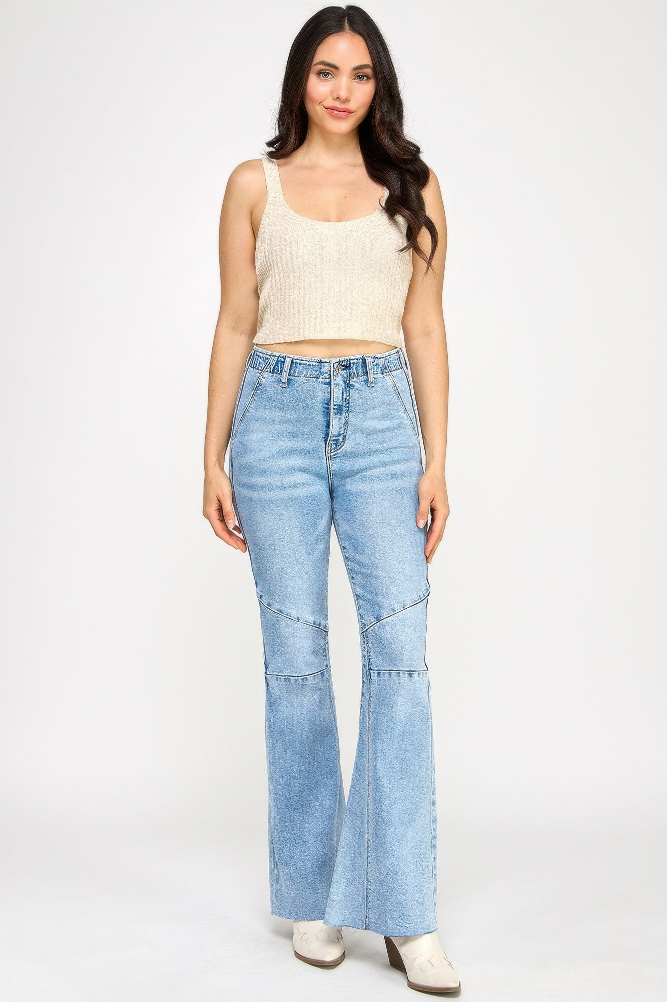 High-rise light-wash denim flare jeans with thigh seam patchwork