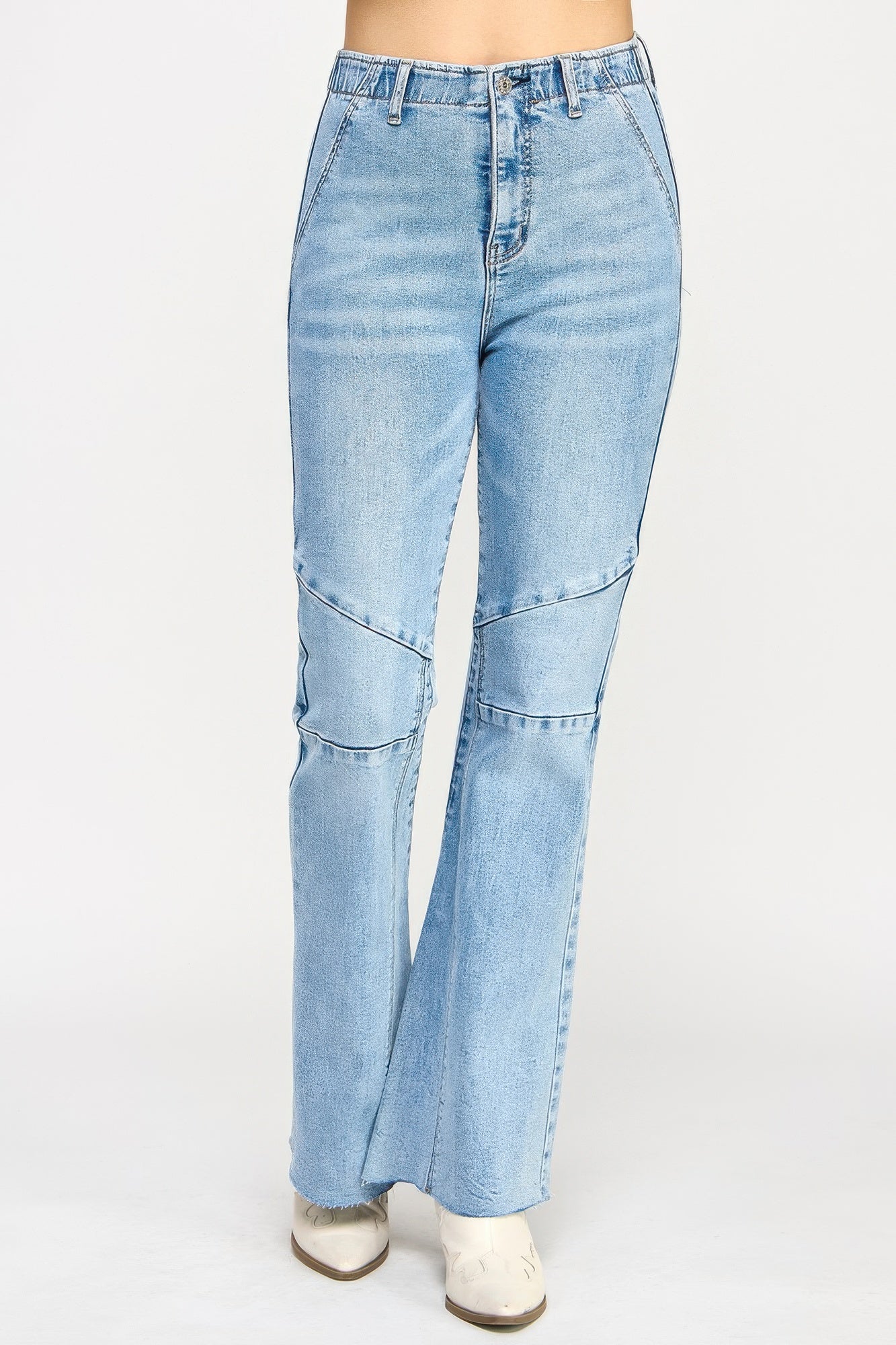 High-rise light-wash denim flare jeans with seam detail and knee patches
