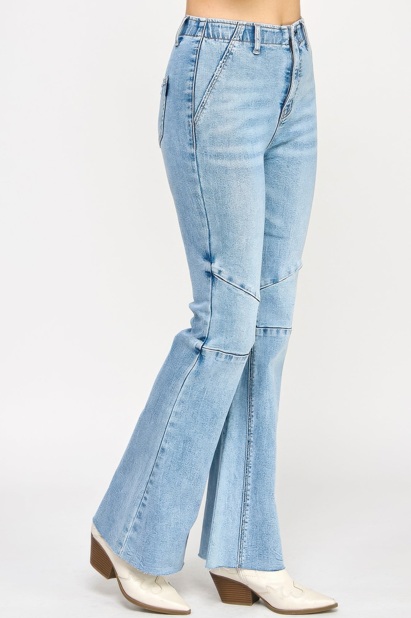 High-rise light-wash denim flare jeans with thigh seam detailing