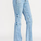 High-rise light-wash denim flare jeans with thigh and knee seam detailing