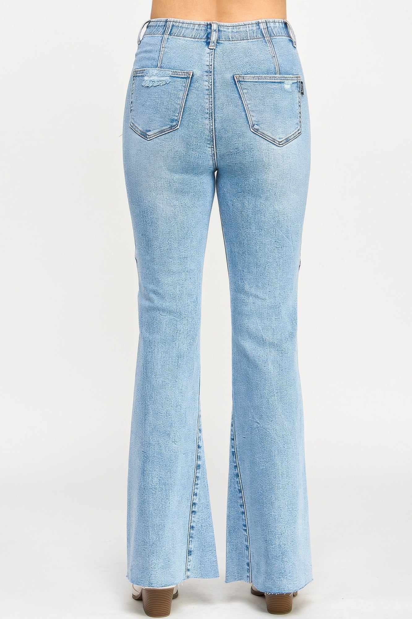 High-rise light-wash denim flare jeans with frayed hems and seam detail