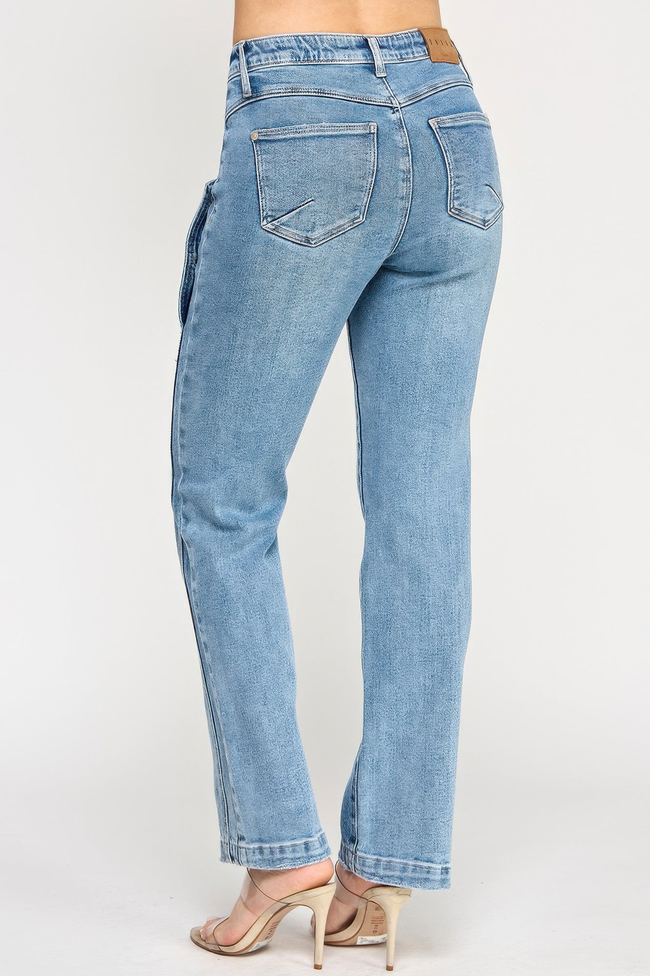 High rise dad jean with light-wash denim, straight-leg cut, and scallop pockets