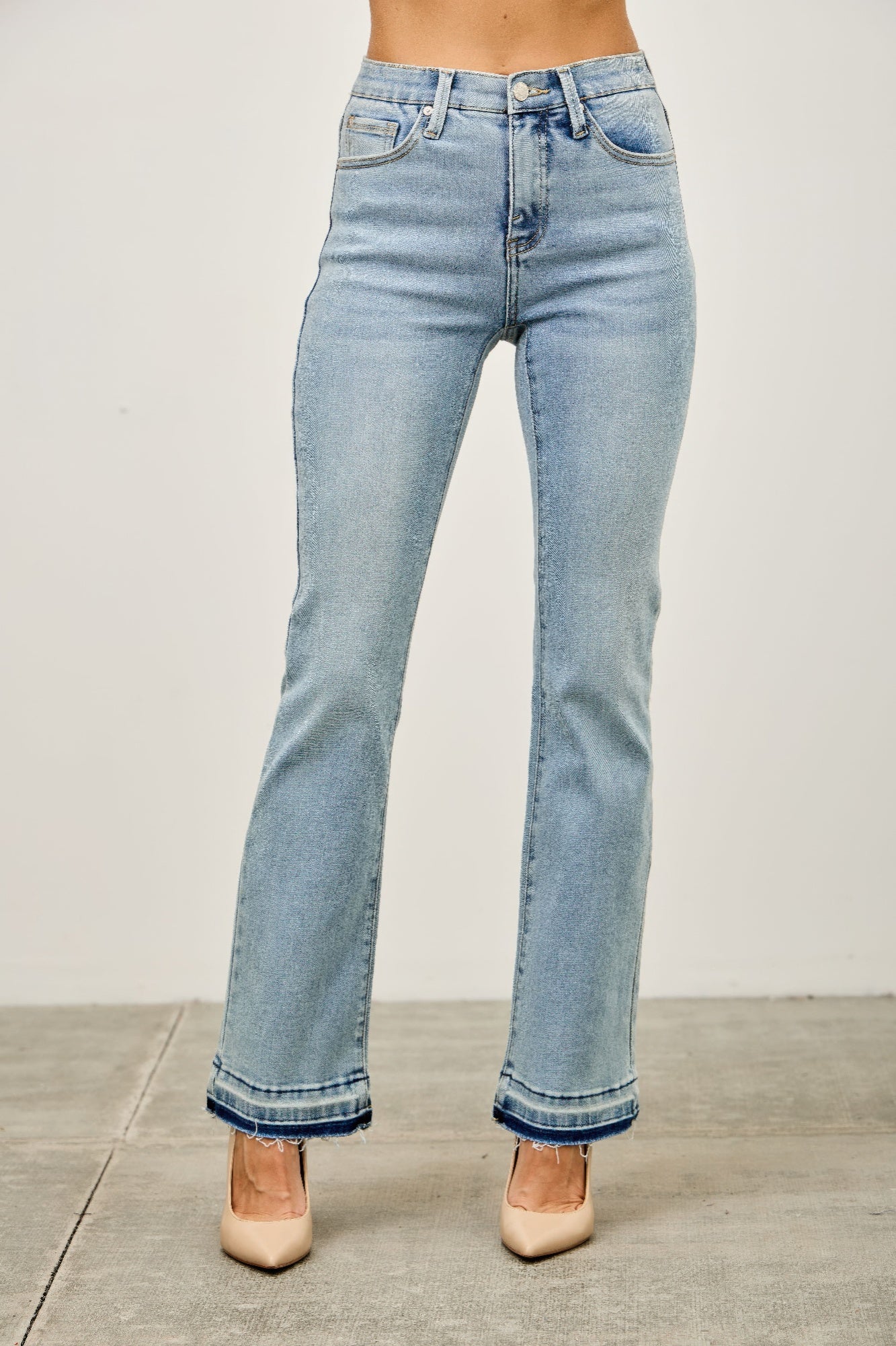 Light-wash high-rise denim flare jeans with frayed hems