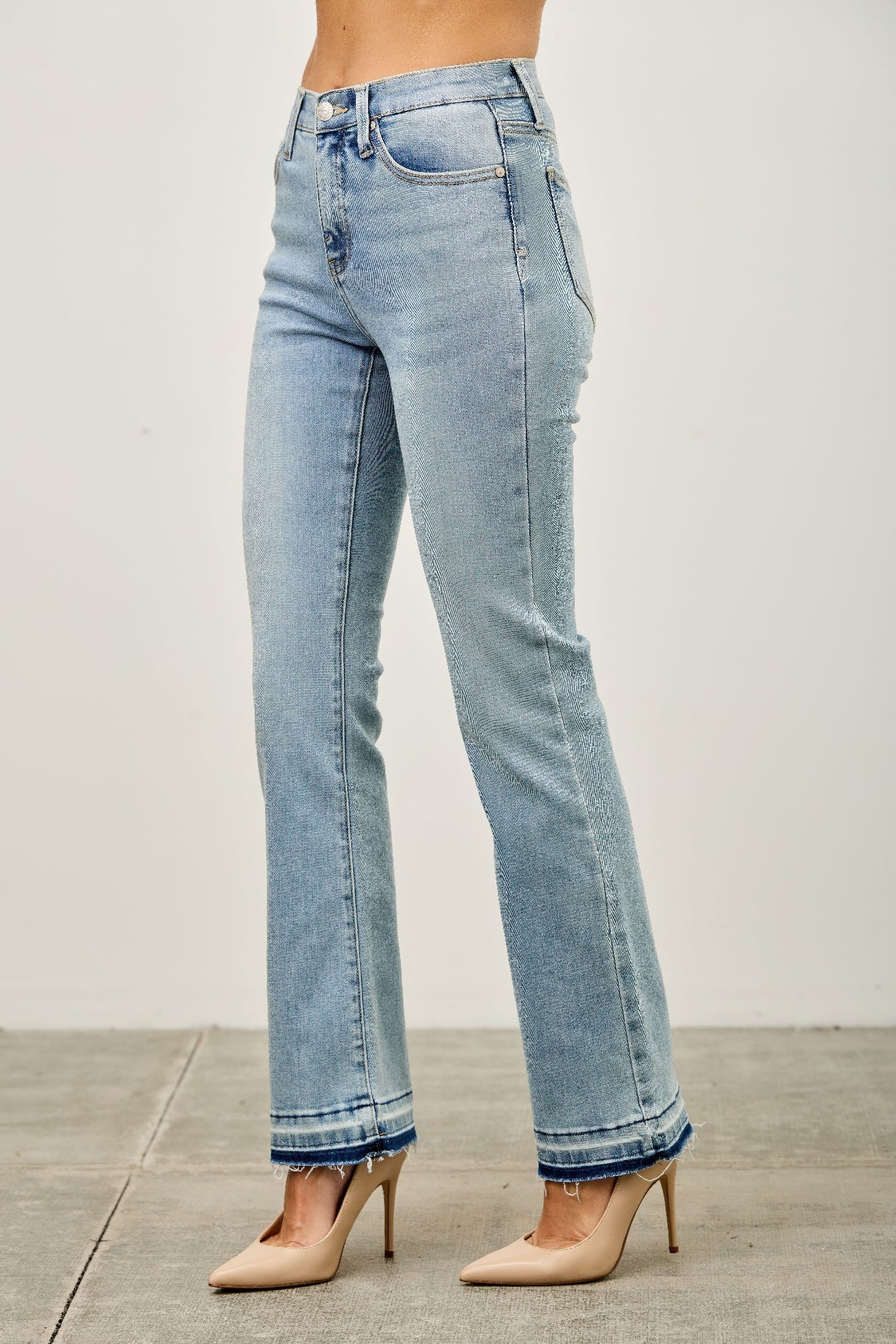 Light-wash high-rise flare jeans with frayed hems
