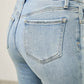 Mid rise flare light-wash denim jeans with Saige label and released hem