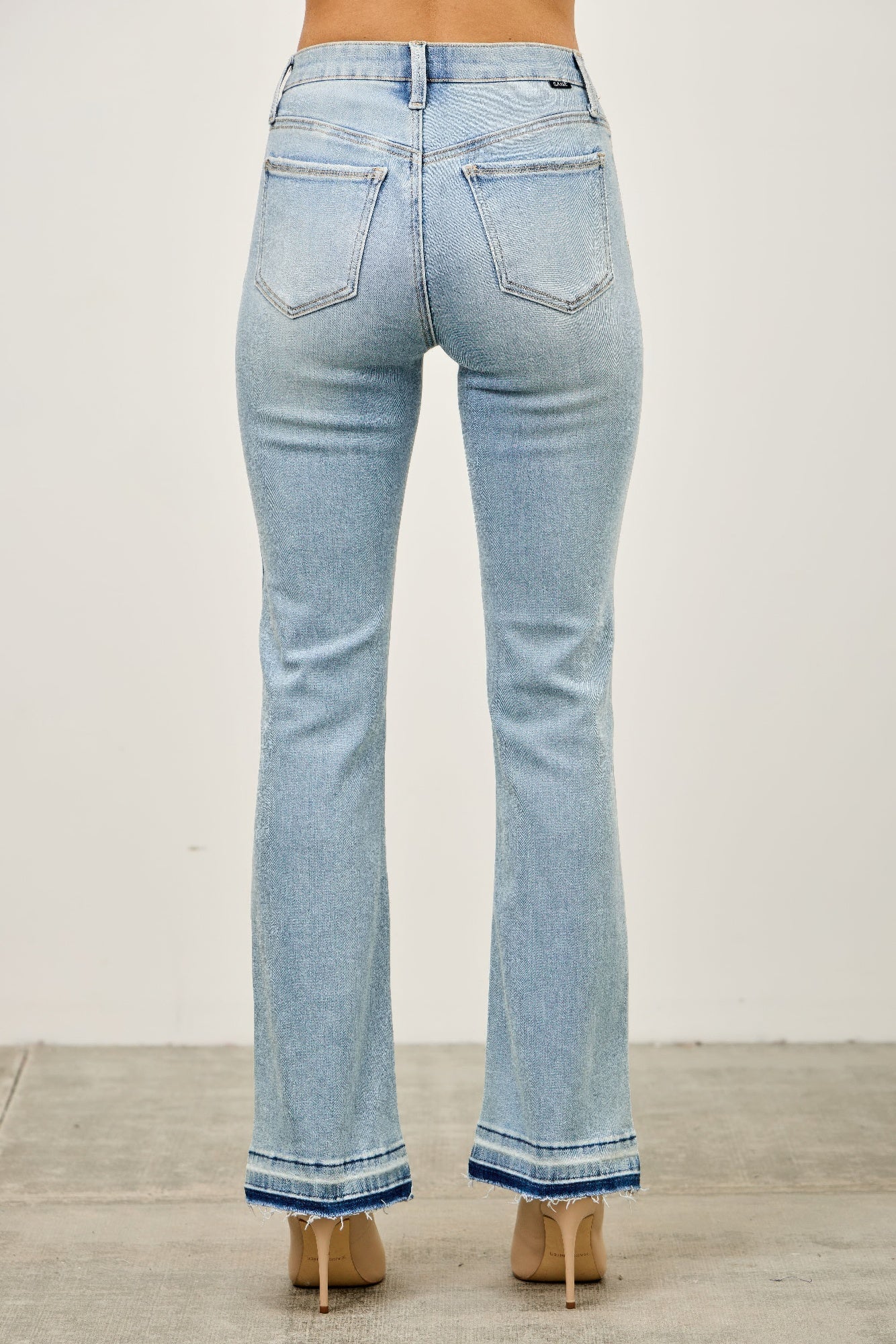 Mid rise light-wash denim flare jeans with frayed hems