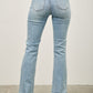 Mid-rise light-wash denim flare jeans with frayed hems