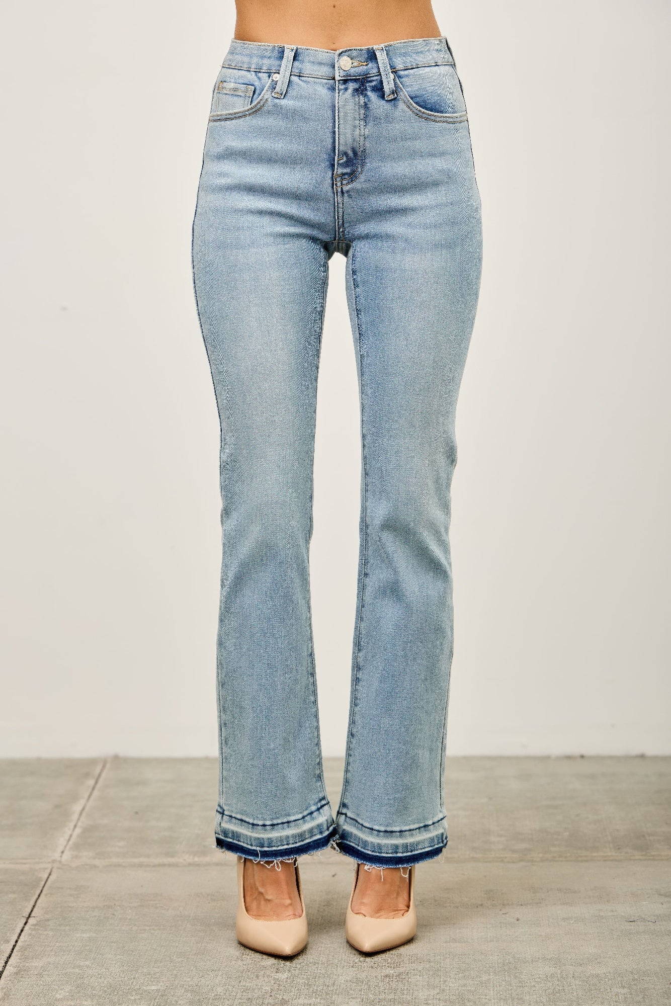 Light-wash high-rise flare jeans with frayed released hem cuffs