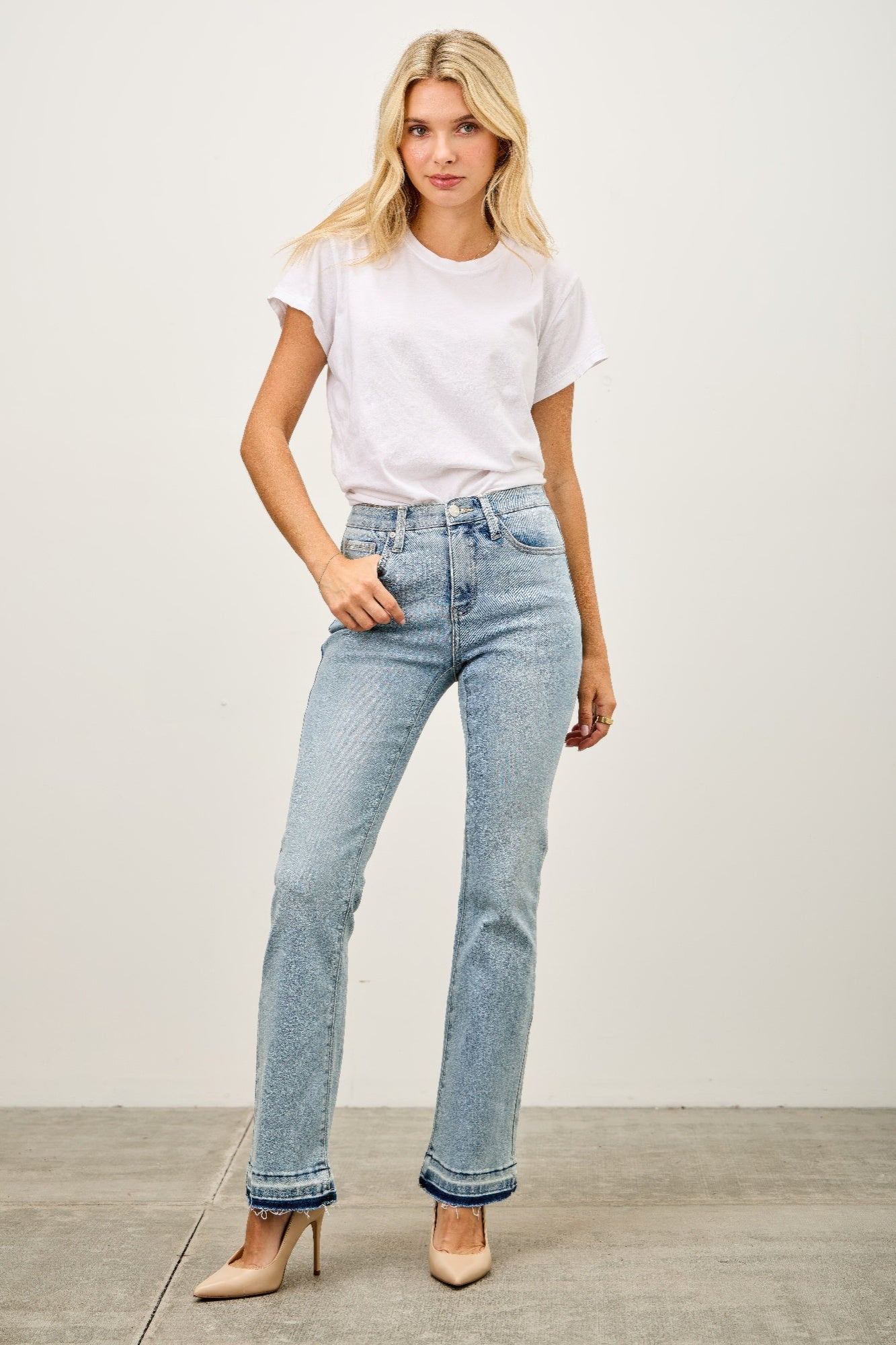 Light-wash high-rise flare jeans with rolled cuffs and released hem