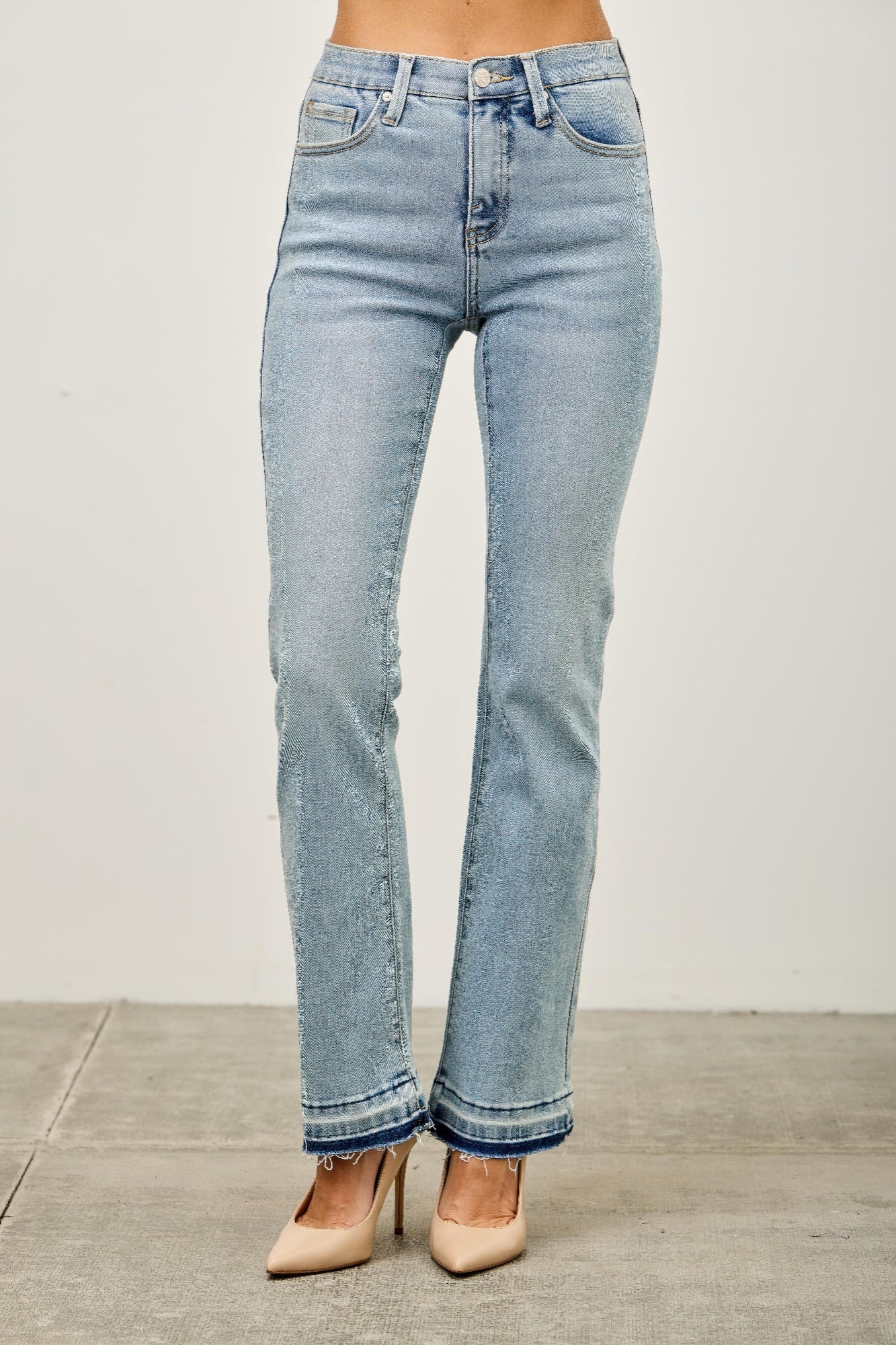 Light-wash high-rise flare jeans with frayed released hem cuffs