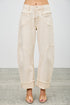 High-rise beige wide-leg denim pants with rolled cuffs and stitched paneling