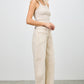 High-rise beige wide-leg denim pants with rolled cuffs and patch pockets
