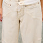 High-rise beige wide-leg denim jeans with relaxed fit and stitching