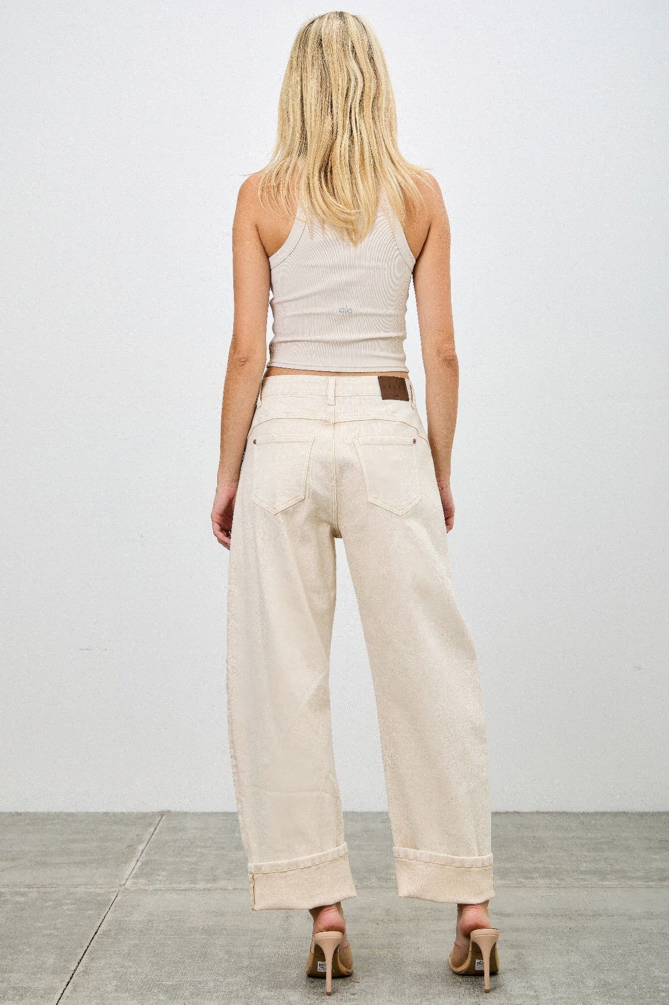 High rise beige wide-leg western barrel denim jeans with rolled cuffs