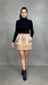Beige faux leather mini skirt with white fur-trimmed pockets and front zipper