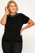 Plus size black knit sweater top with white rhinestone dots