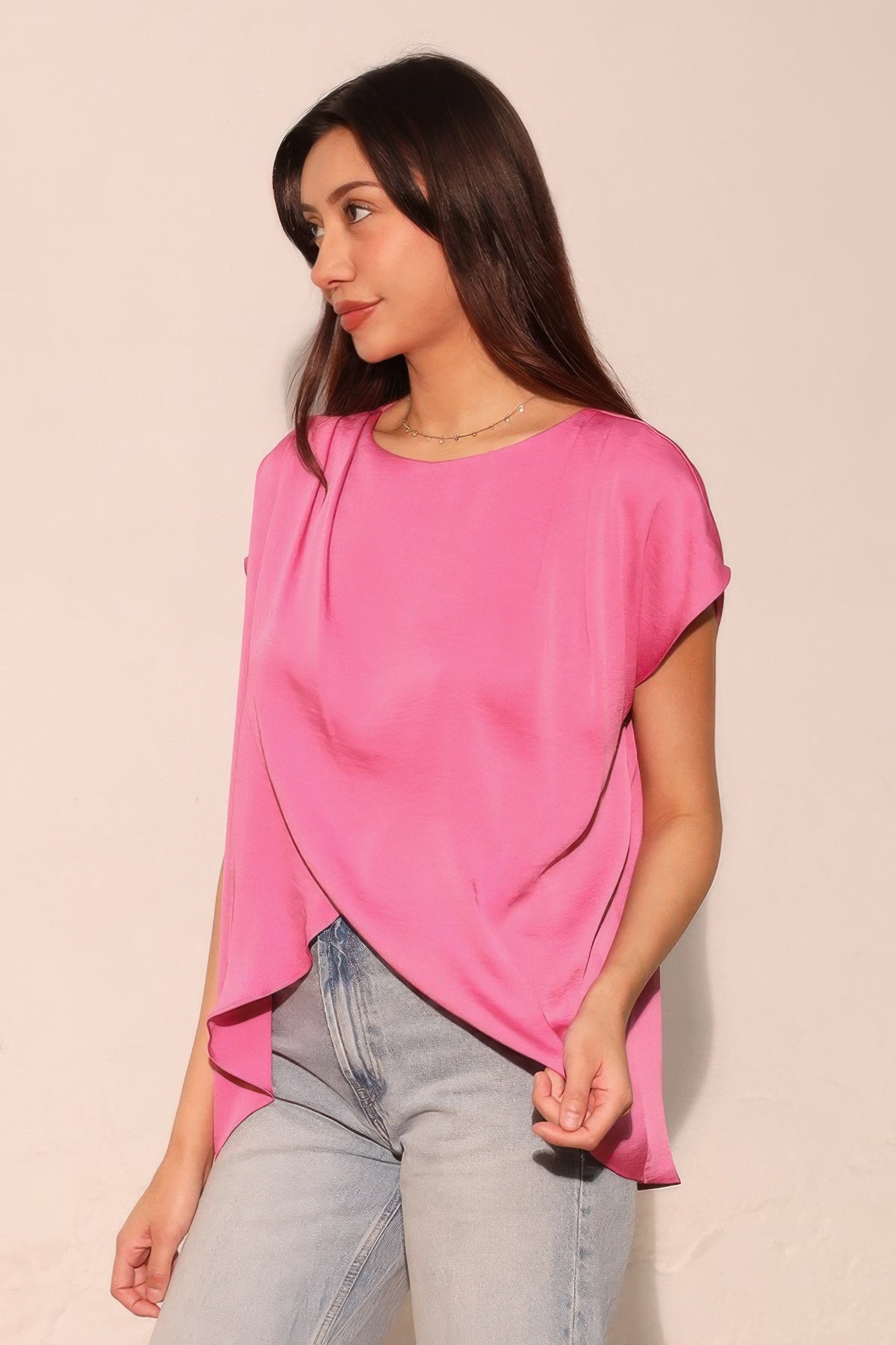Washed poly silk tulip tunic top in soft pink with draped asymmetrical hem