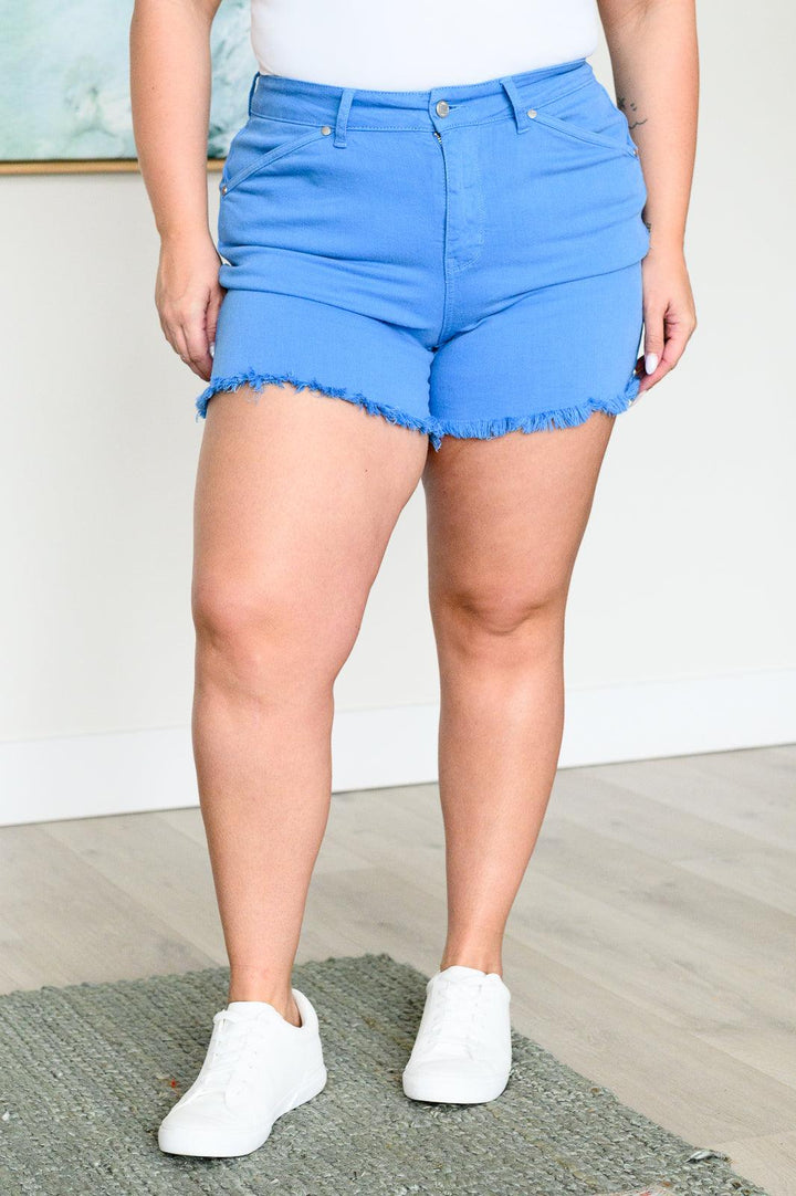 Celeste Mid Rise Shield Pocket Cutoff Shorts in Sky Blue Shorts