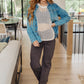 Cream coastal dreams fishnet top with blue denim jacket, button closures, rolled sleeves
