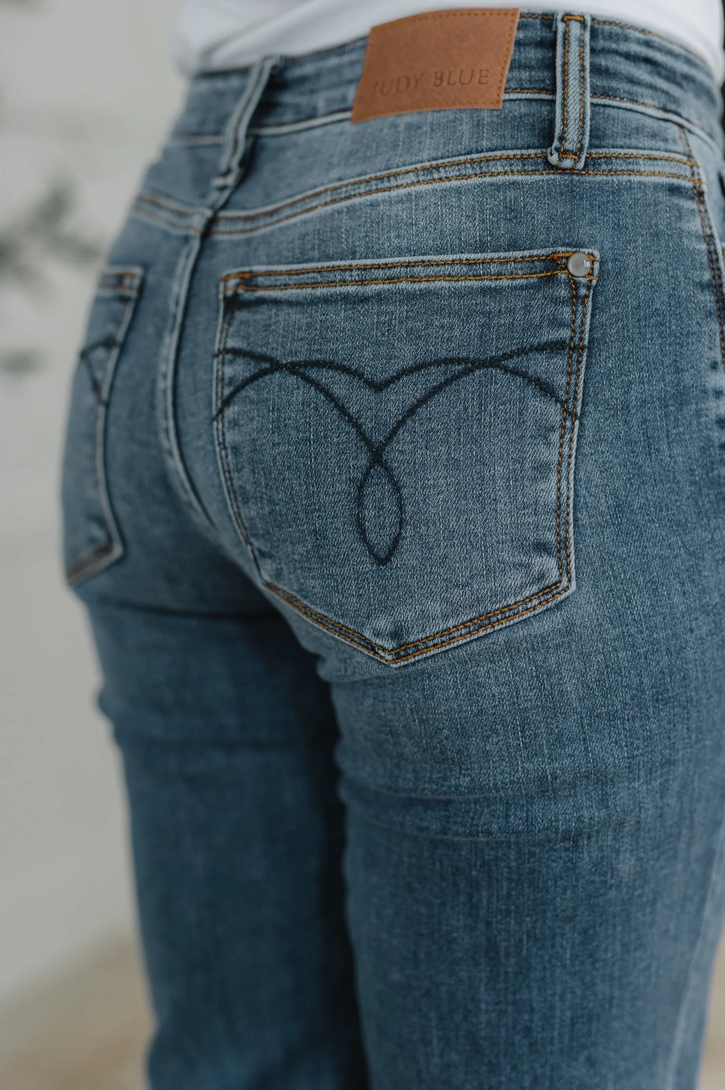 Colette Mid Rise Boyfriend Classic Cuffed blue denim jeans with stitching and leather patch