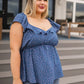 Blue polka dot ruffled Connect the Dots Peplum Blouse with denim jeans