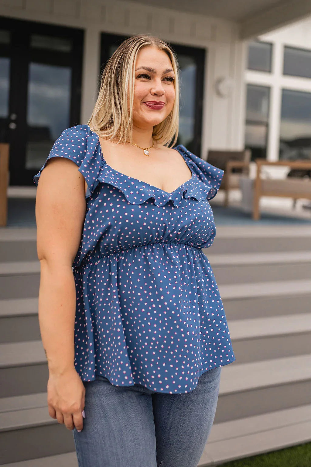Blue polka dot ruffled Connect the Dots Peplum Blouse with denim jeans