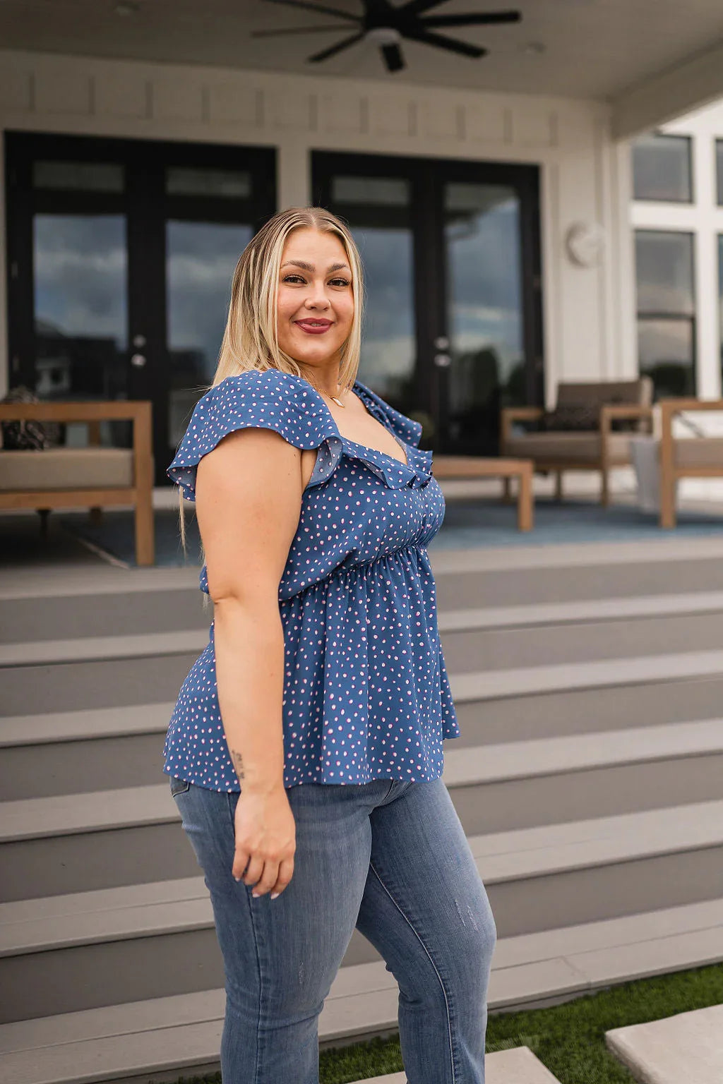 Blue polka dot Connect the Dots Peplum Blouse with ruffled sleeves and V-neck