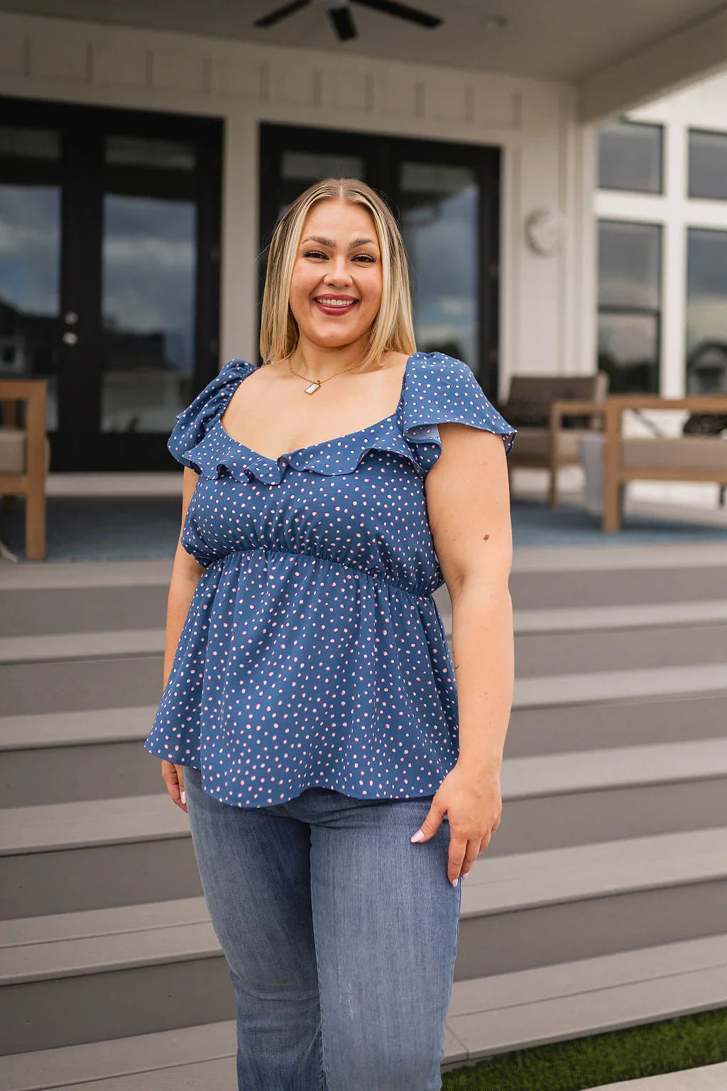 Blue polka dot ruffled Connect the Dots Peplum Blouse with denim jeans