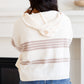 Cream-colored White Birch knit hoodie with taupe back stripes