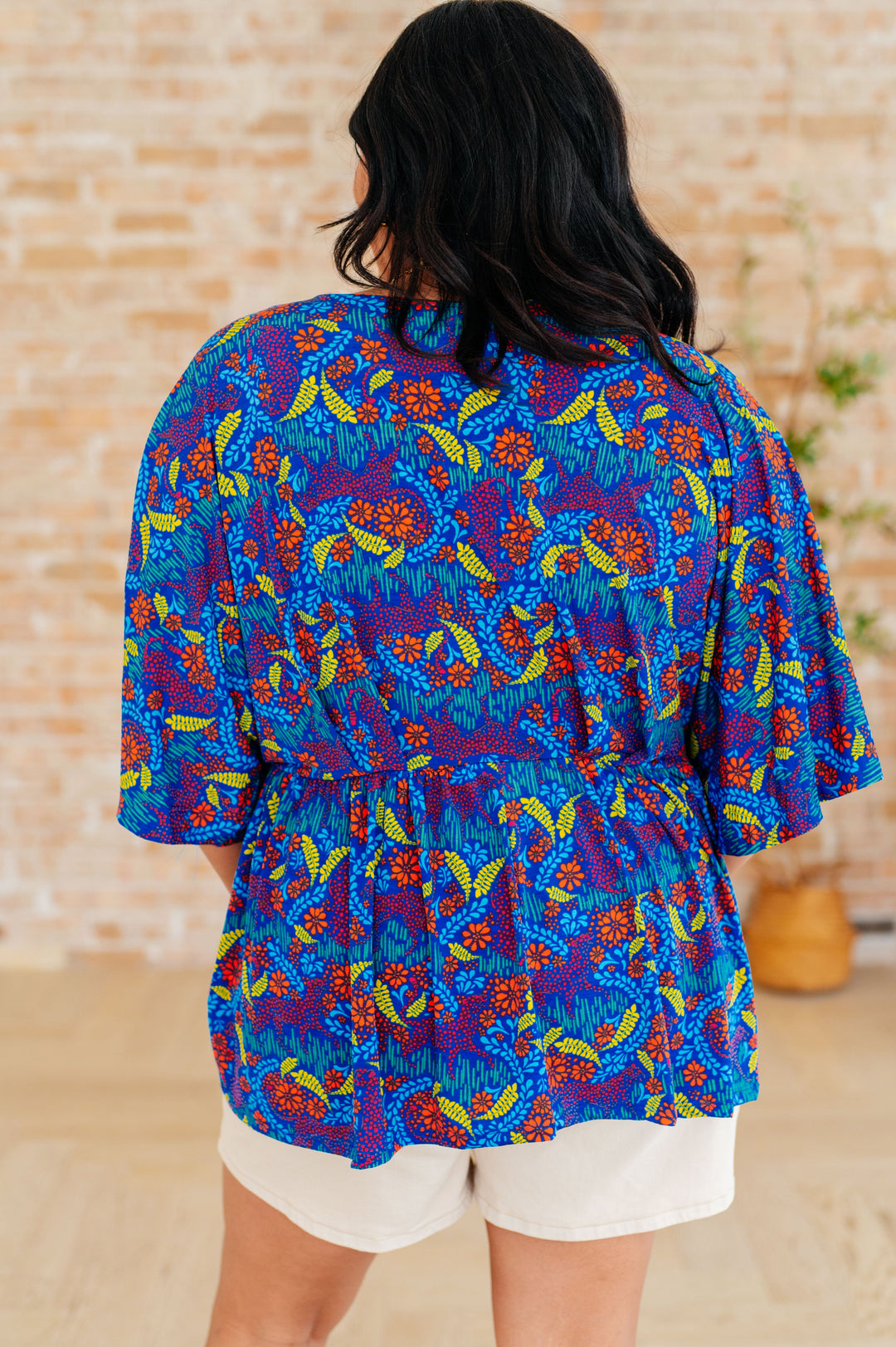 Dreamer Peplum Top in Royal and Red Abstract Tops