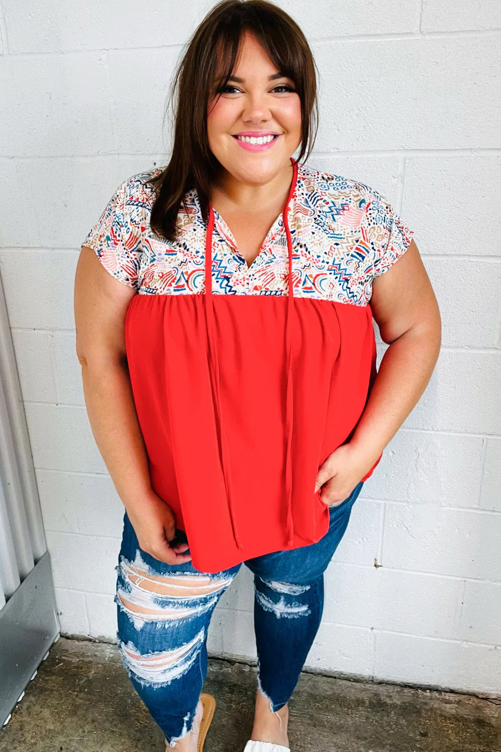 Red boho print tie neck dolman top with v-neck and floral design