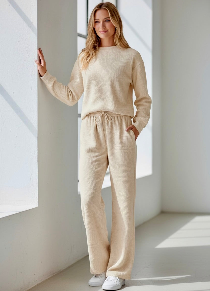 Cream-colored knit womens sweatsuit with textured fabric and drawstring waistband