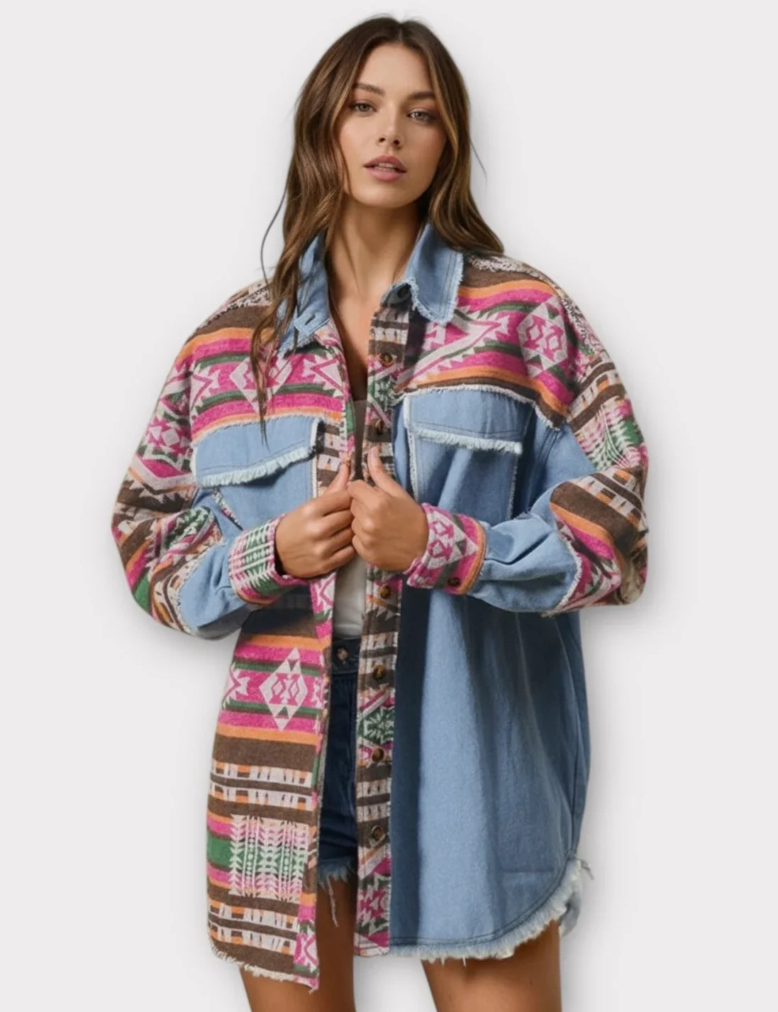 Multi-colored patchwork denim shacket with Aztec patterns and frayed edges