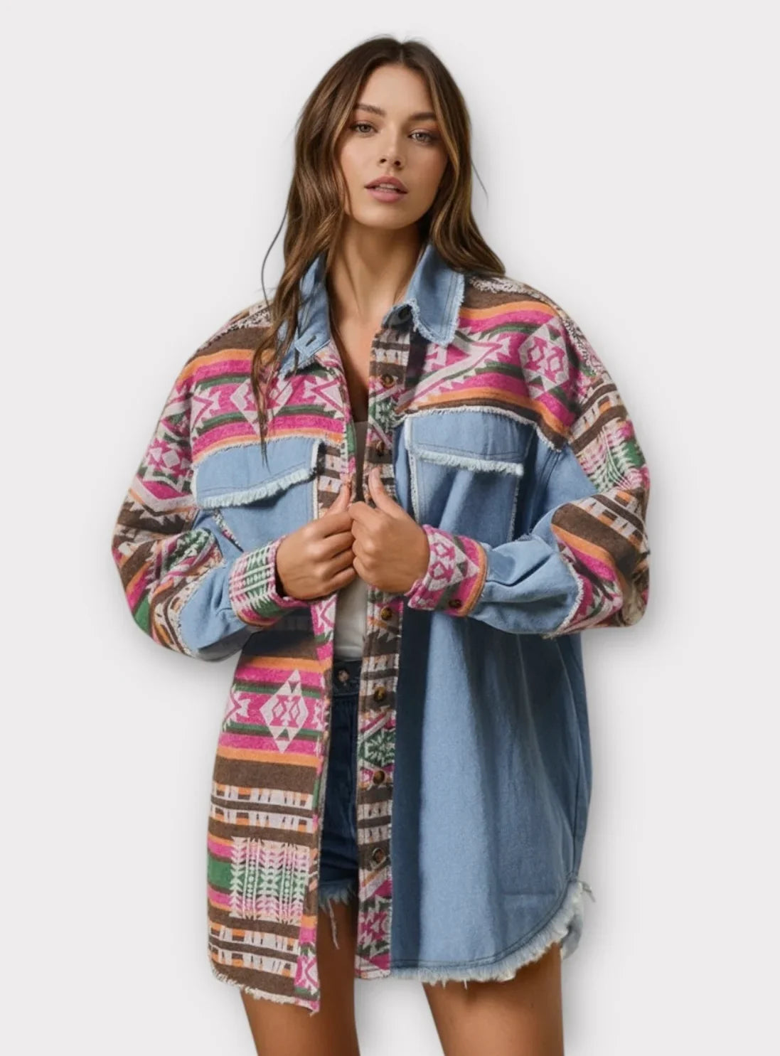 Multi-colored patchwork denim shacket with Aztec patterns and frayed edges