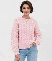 Pink cable knit long sleeve sweater with ribbed cuffs and hem