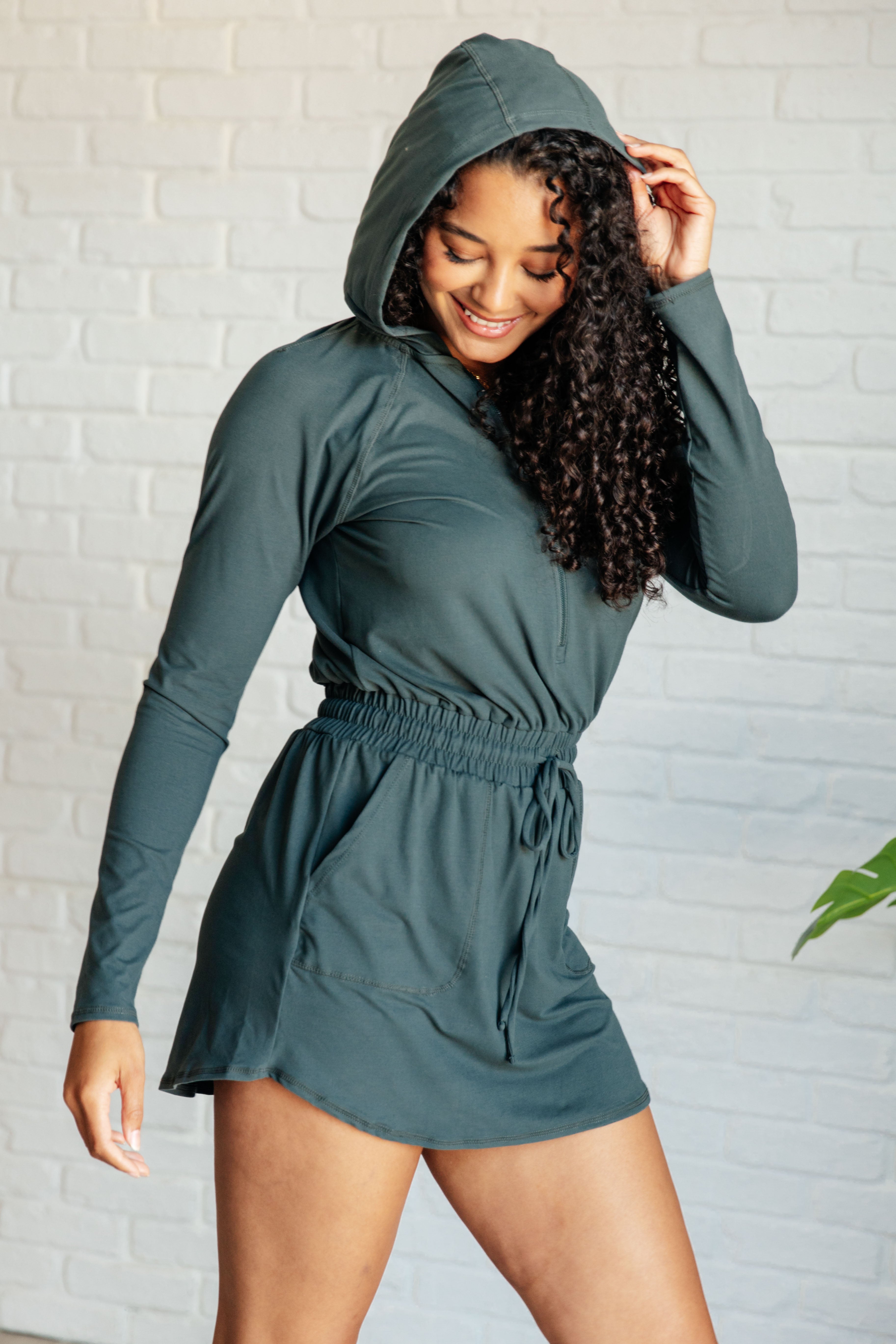 Getting Out Long Sleeve Hoodie Romper in Smoked Spruce Jumpsuits & Rompers