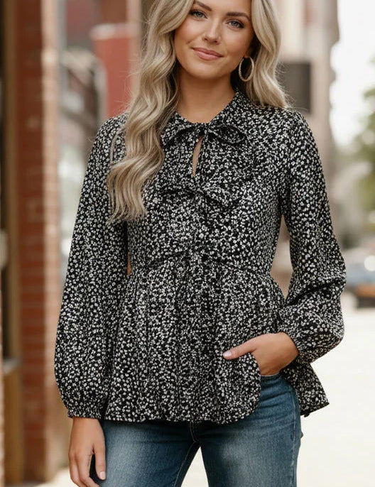 Midnight Petal Bowtie Blouse: black and white floral with ruffled neckline